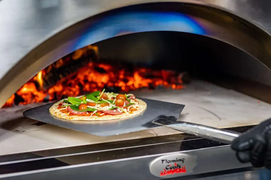 Wood fired pizza oven with 28 to 30 mm thick double wall insulated construction retaining high heat during cooking
