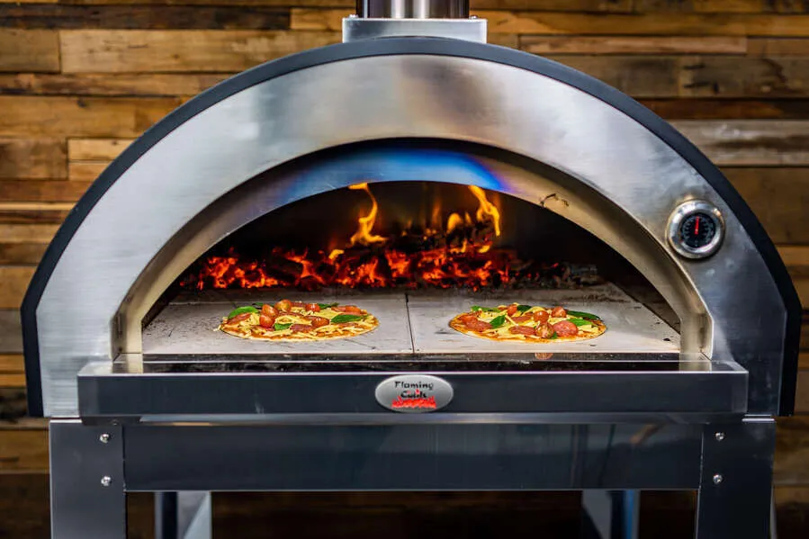 Flaming Coals marine grade wood fired pizza oven cooking pizzas with live flame and stone base