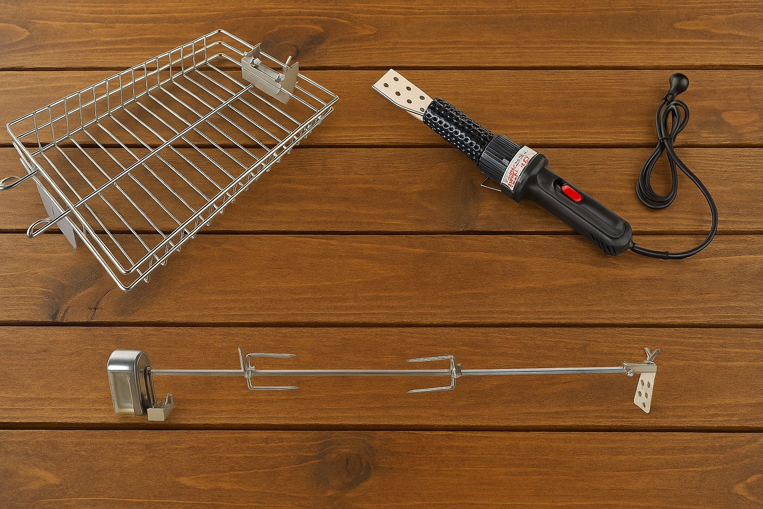 Stainless steel rotisserie basket, electric charcoal starter wand, and a complete rotisserie spit kit with motor and skewer forks displayed 