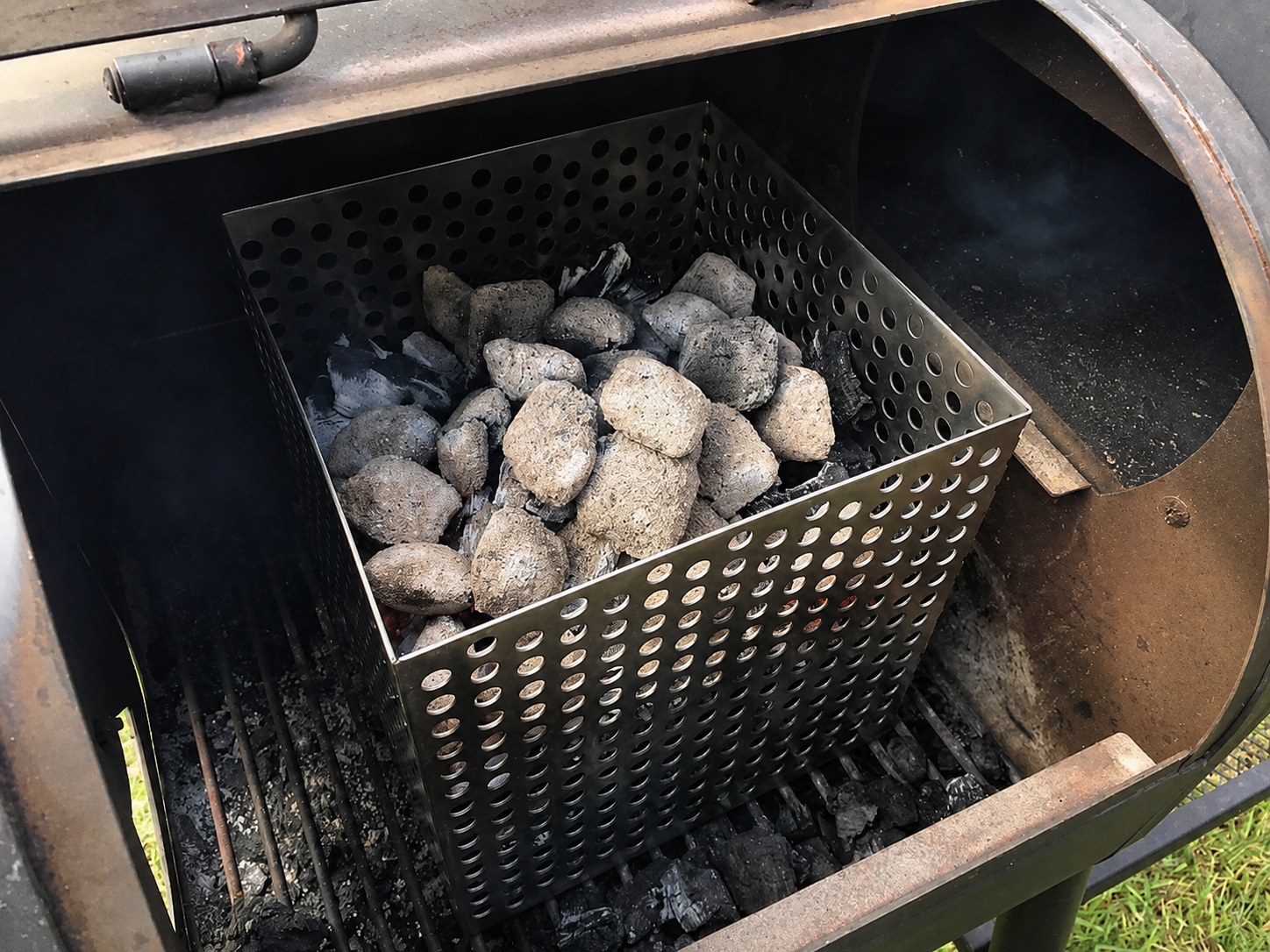 This image shows the offset smoker charcoal basket. This image shows the offset smoker charcoal basket.