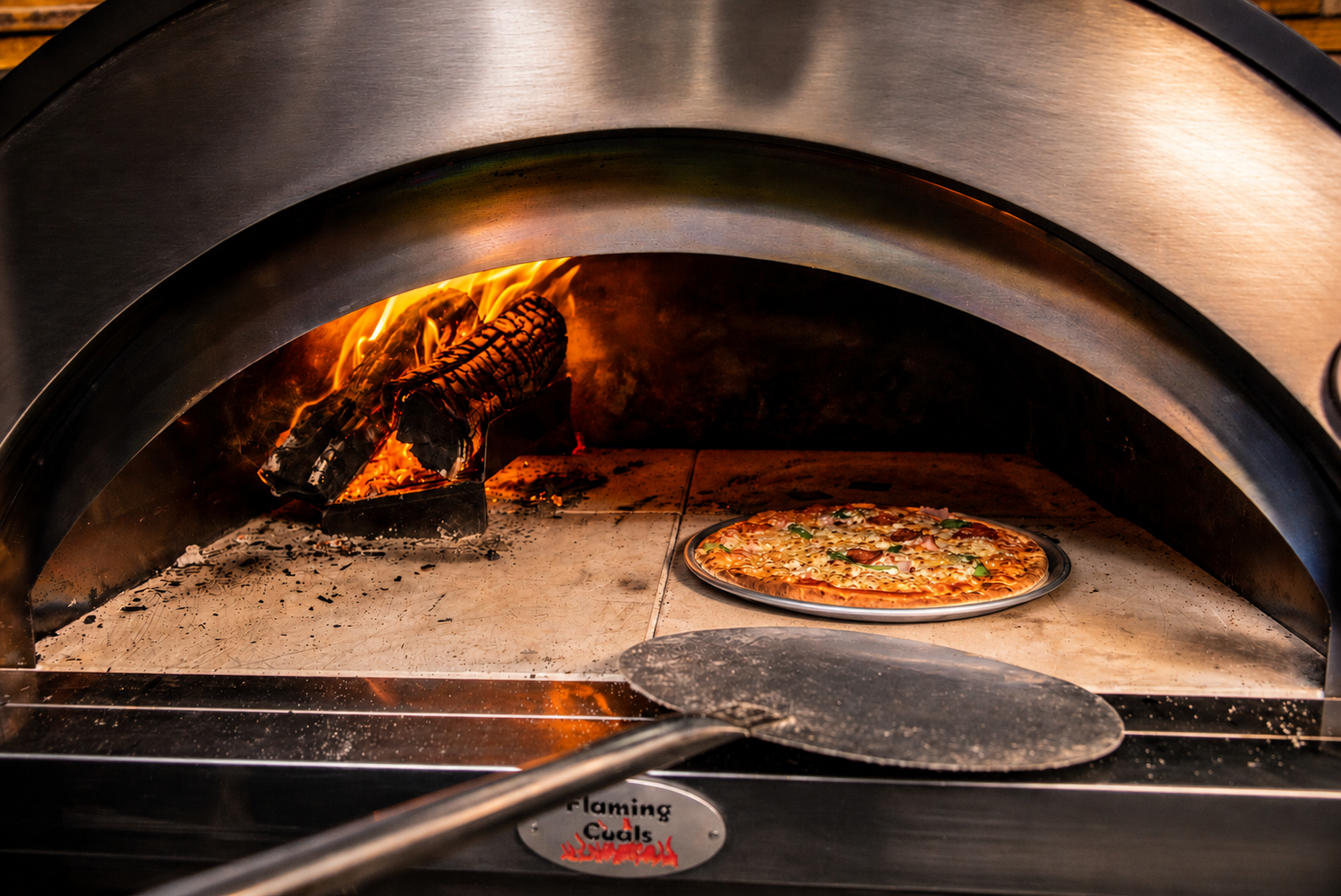 This image shows the aluminum pizza tray used to cook a pizza.