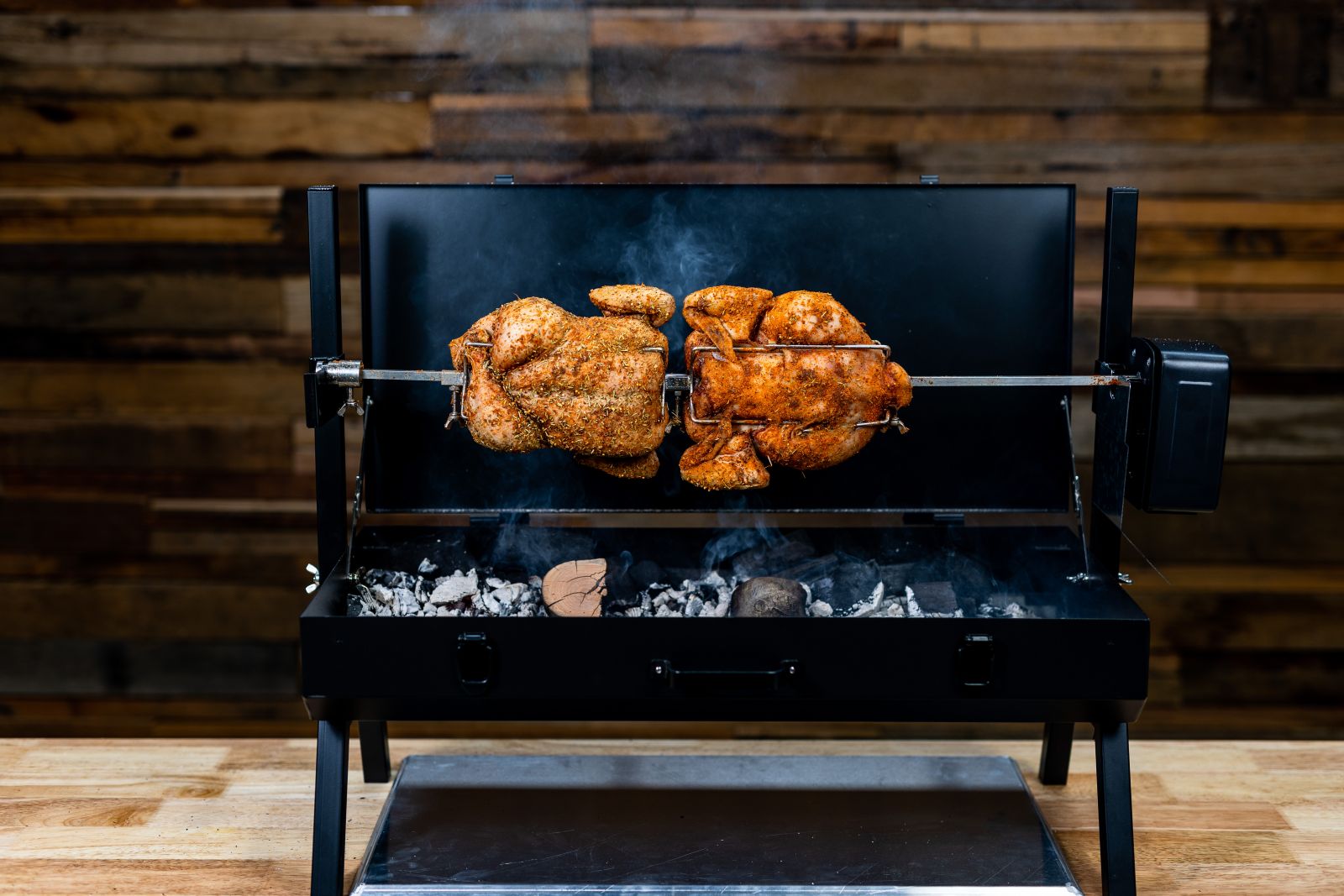 This image shows the mini spit cooking chooks.