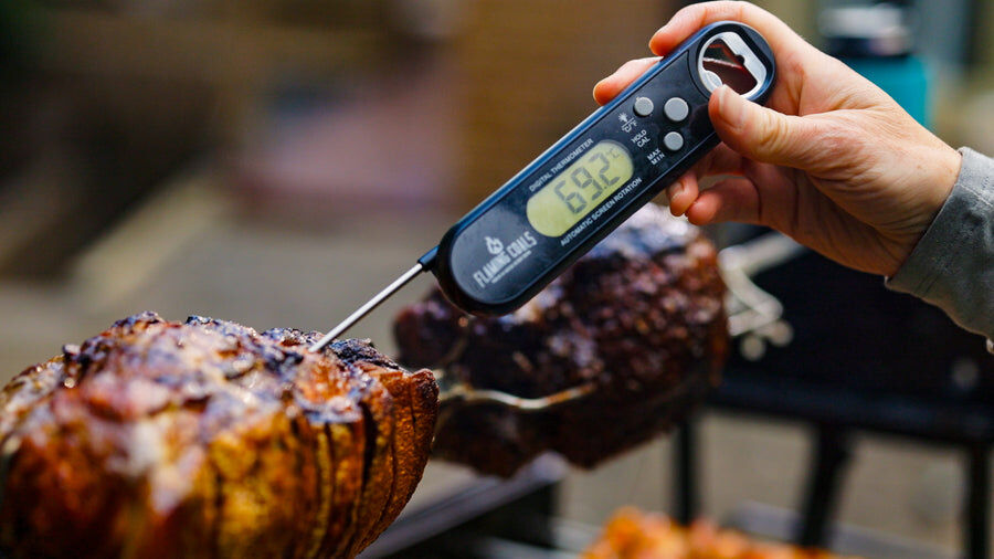 This_image_shows_digital_meat_thermometer_being_used_to_check_temperature_of_the_meat 