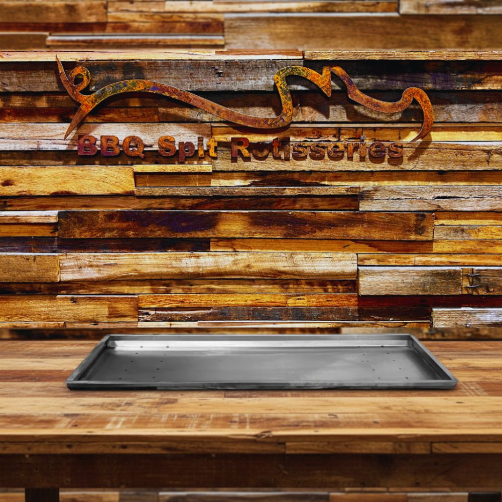 This image shows drip tray place on table with BBQ Spit Rotisseries This image shows drip tray place on table with BBQ Spit Rotisseries
