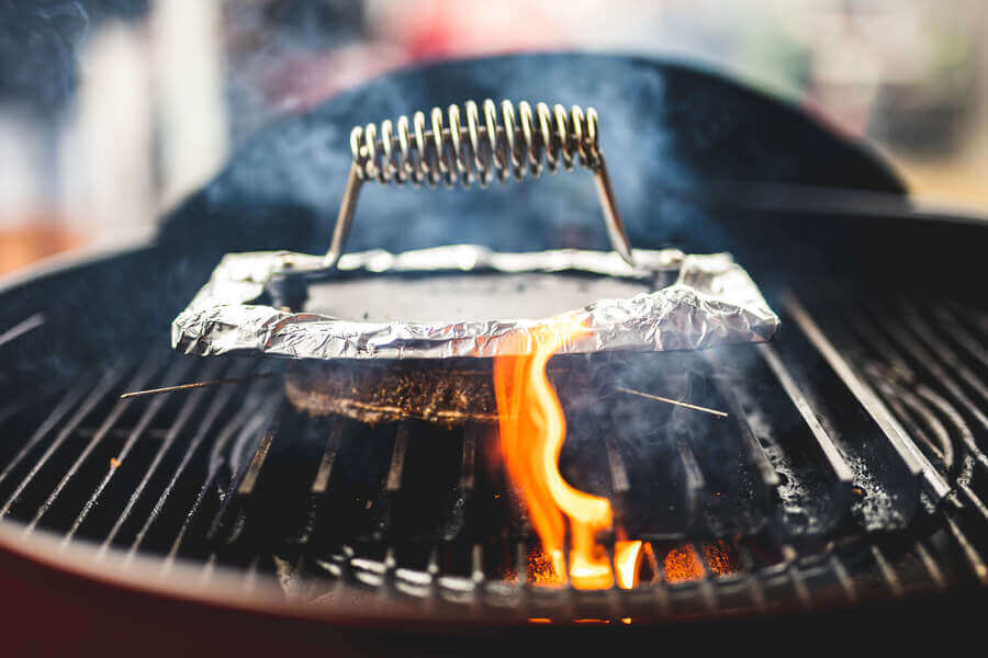 This image shows the hamburger press used while cooking hamburgers.