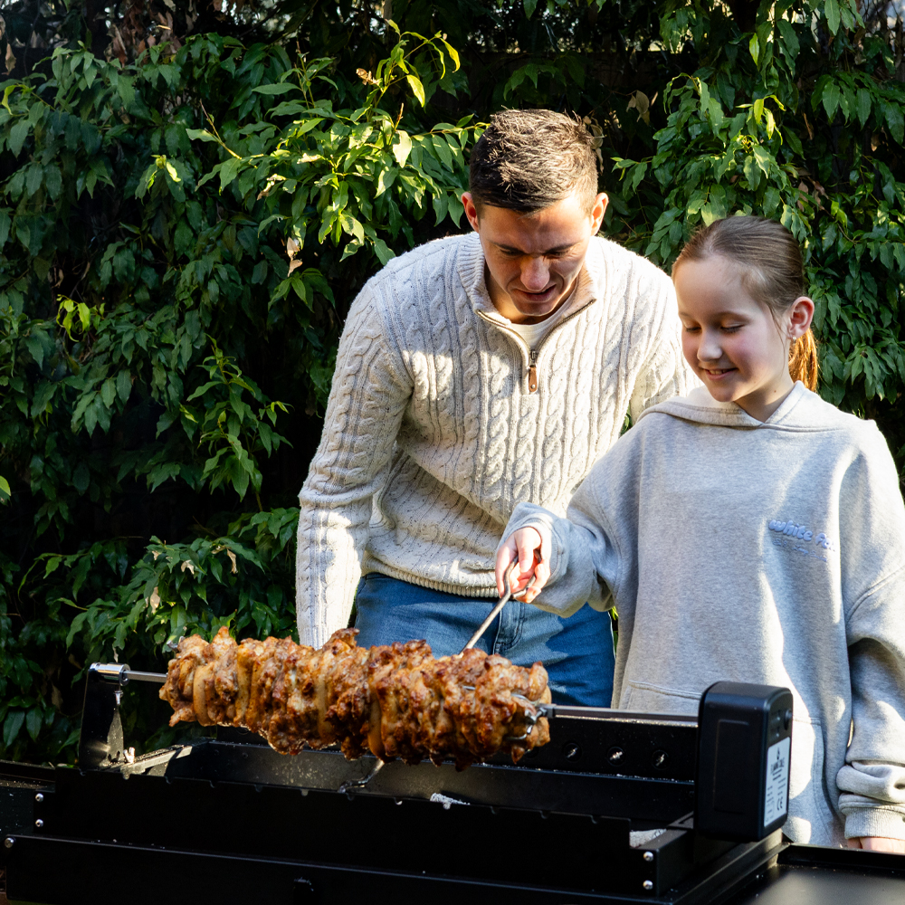 This image shows the Mangal Charcoal Grill cooking gyros. This image shows the Mangal Charcoal Grill cooking gyros.