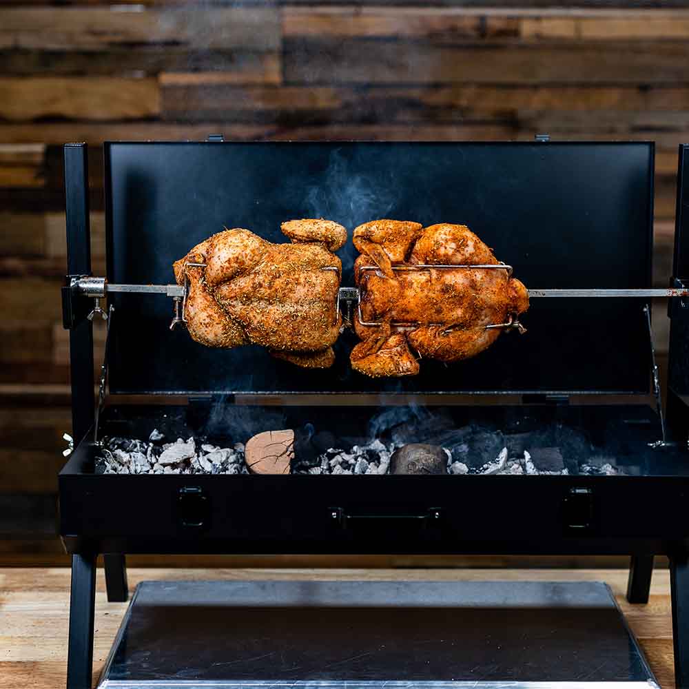 This_image_shows_Mini_spit_roaster_being_used_to_cook_chickens