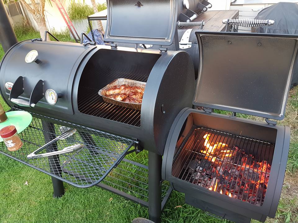 This image shows the Flaming Coals Offset Smoker smoking chickens.