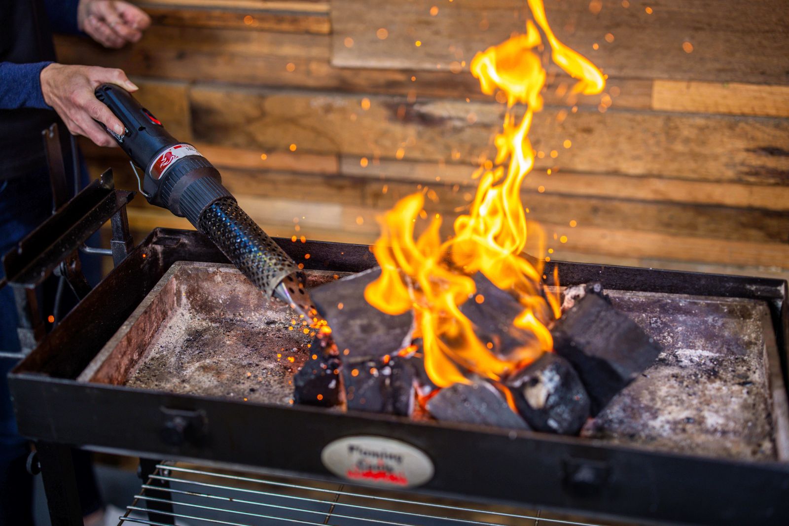 This_image_shows_lump_charcoal_being_lit_with_charcoal_starter_wand 